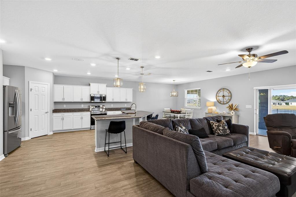 82 Berlin Avenue St. Cloud, FL 34771 - Photo 9 of 44 a living room with stainless steel appliances furniture and a view of kitchen