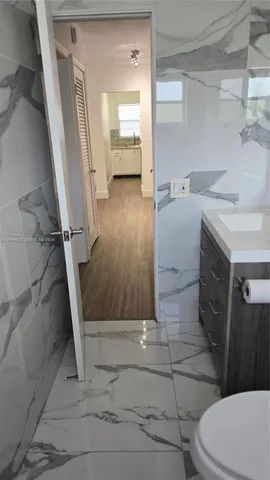 a bathroom with a sink and toilet