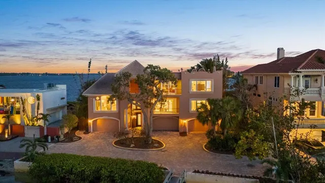 a dining room with furniture a rug and a chandelier
