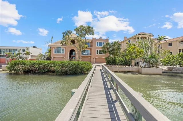 a view of a dining room with furniture wooden floor and chandelier