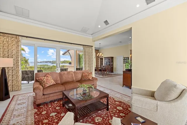 a kitchen with a table chairs sink and cabinets