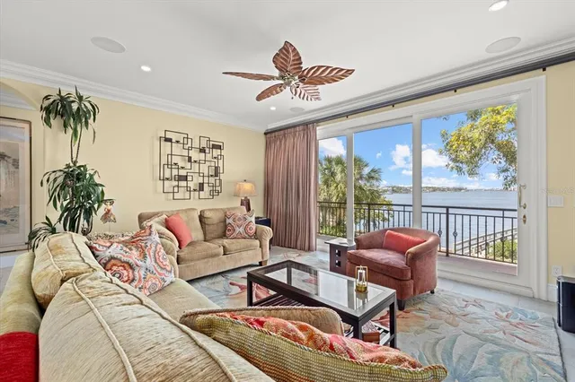 a kitchen with stainless steel appliances granite countertop a sink a stove a refrigerator a microwave oven with cabinets and refrigerator