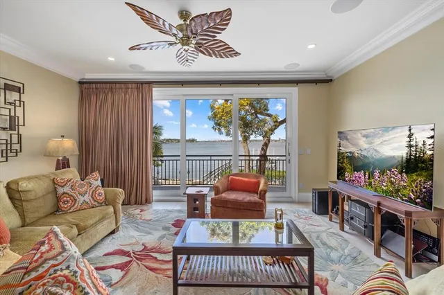 a bedroom with furniture and a large window