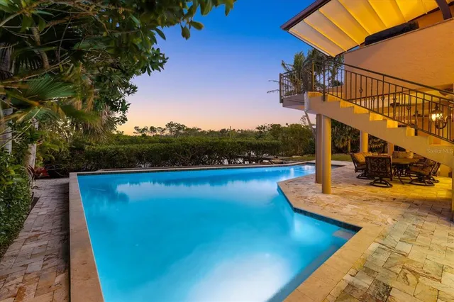 a view of multiple houses with a ocean