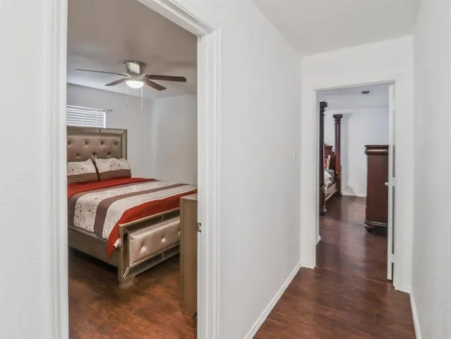 a view of a workspace with furniture and a bedroom
