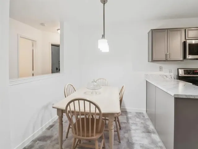a view of a a dining room with furniture