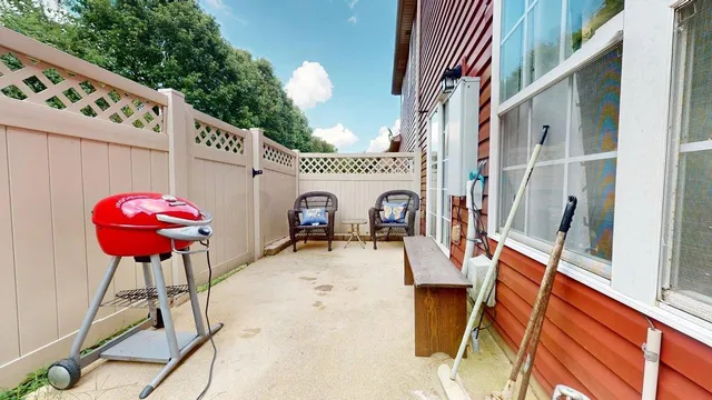 a view of living room with furniture and a fireplace