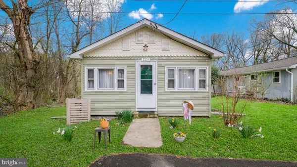 a front view of house with garden