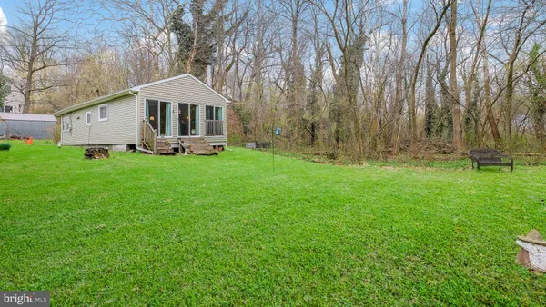 a front view of a house with a yard table and chairs