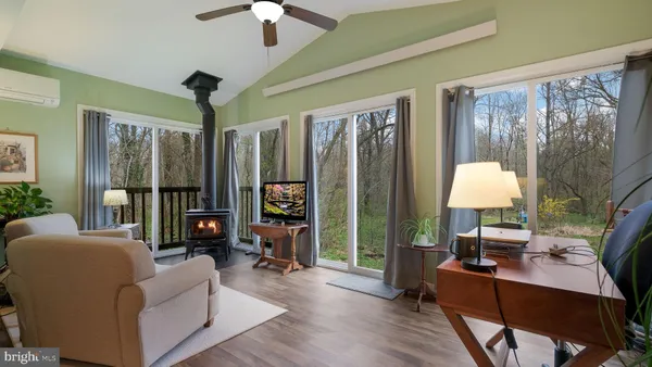 a living room with furniture and a window