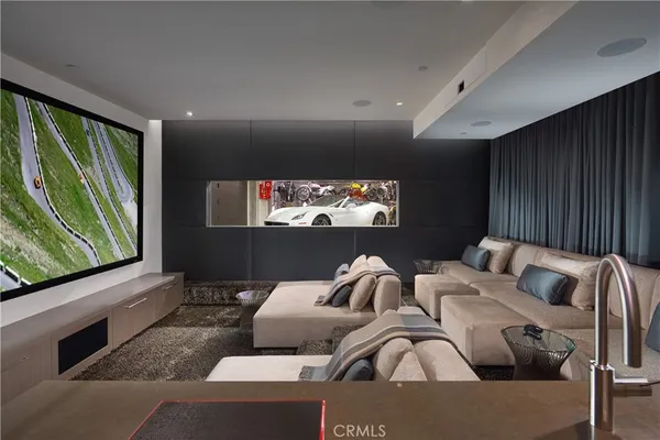 a large bathroom with a large mirror vanity and sink