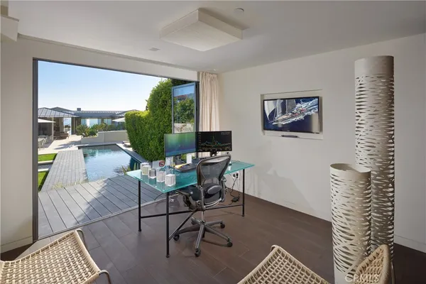a bedroom with a large bed and a large window