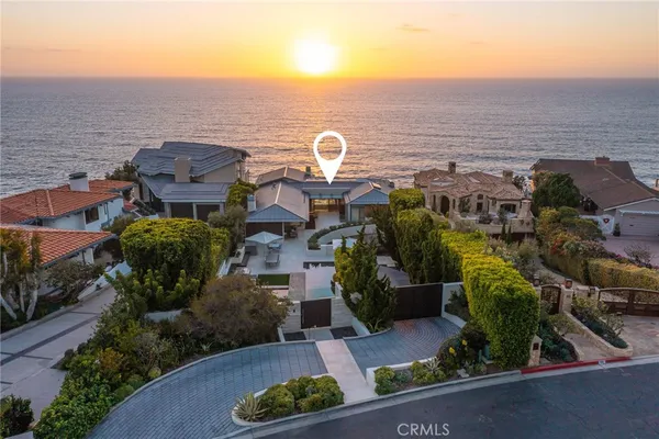 a view of a town with mountains in the background