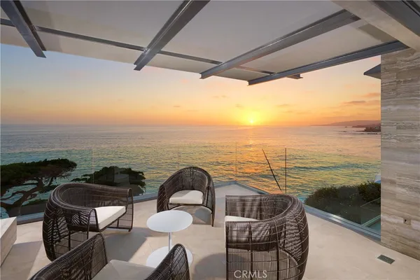 a kitchen with a table and chairs in it