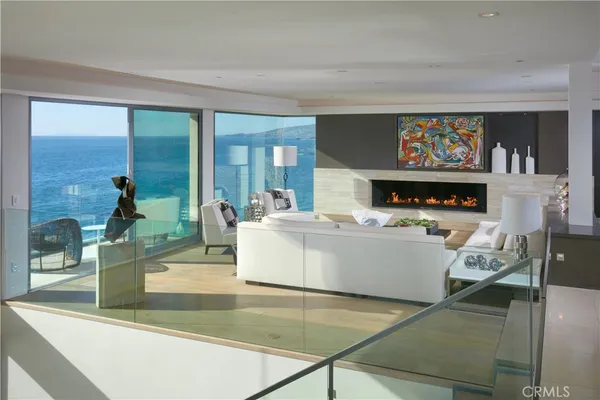 a kitchen with a sink and chairs