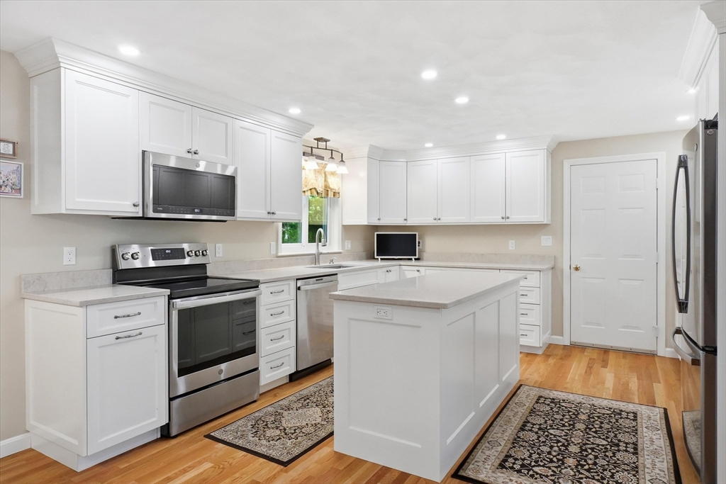 9 Fazio Farm Road Georgetown, MA 01833 - Photo 6 of 42 a kitchen with a sink stove and refrigerator