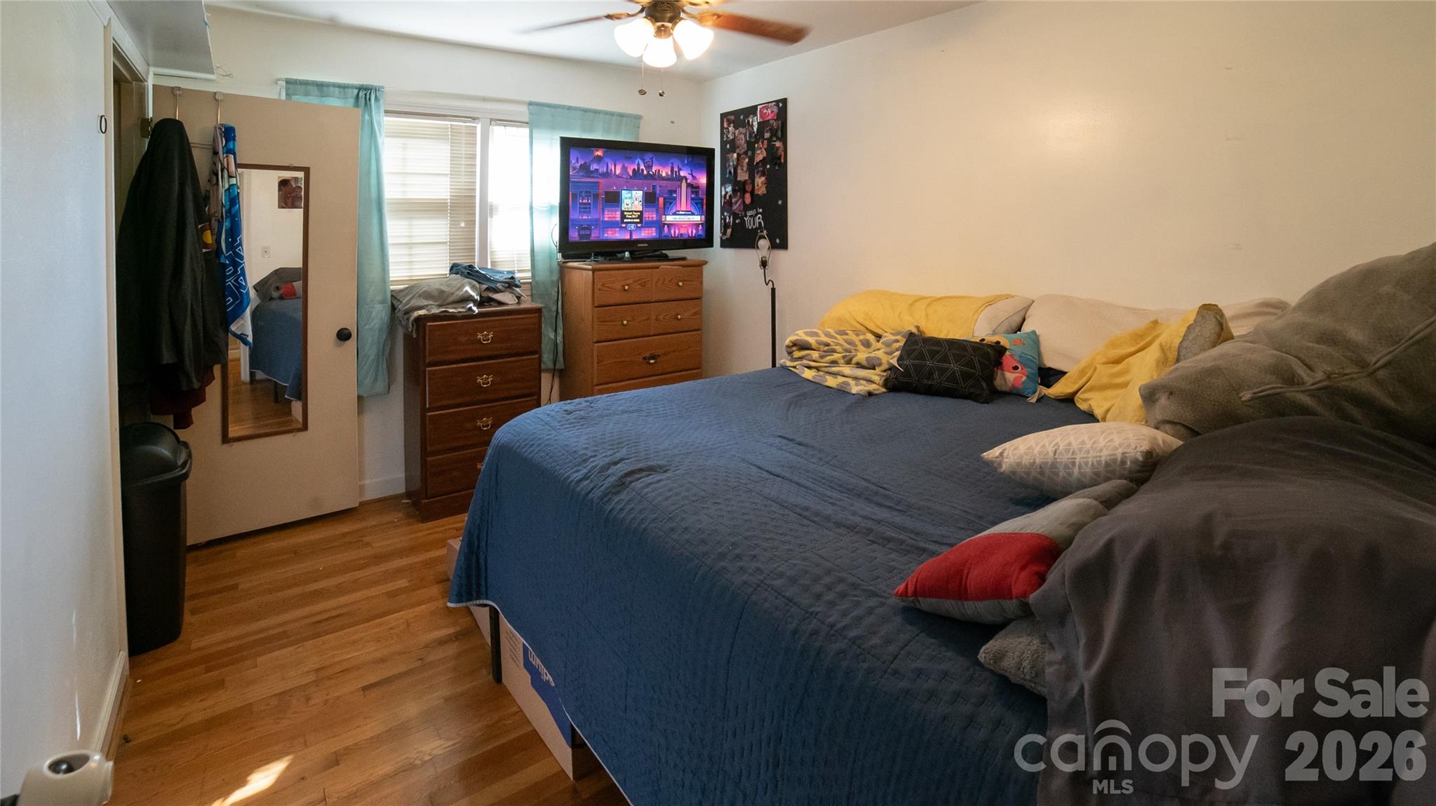 324 Golf Course Road Morganton, NC 28655 - Photo 14 of 21 a bedroom with a bed and a television
