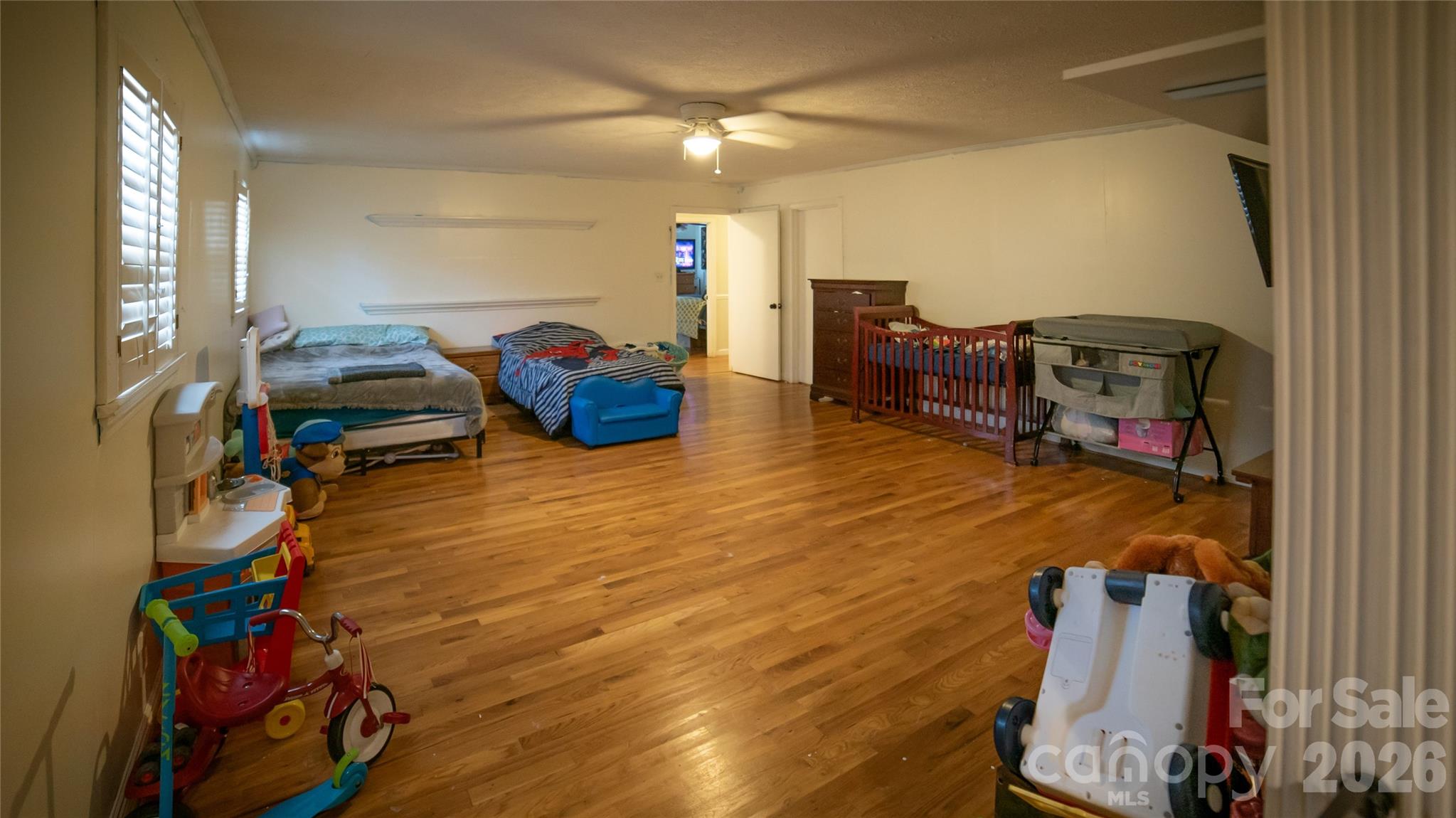 324 Golf Course Road Morganton, NC 28655 - Photo 16 of 21 a bedroom with furniture and a wooden floor