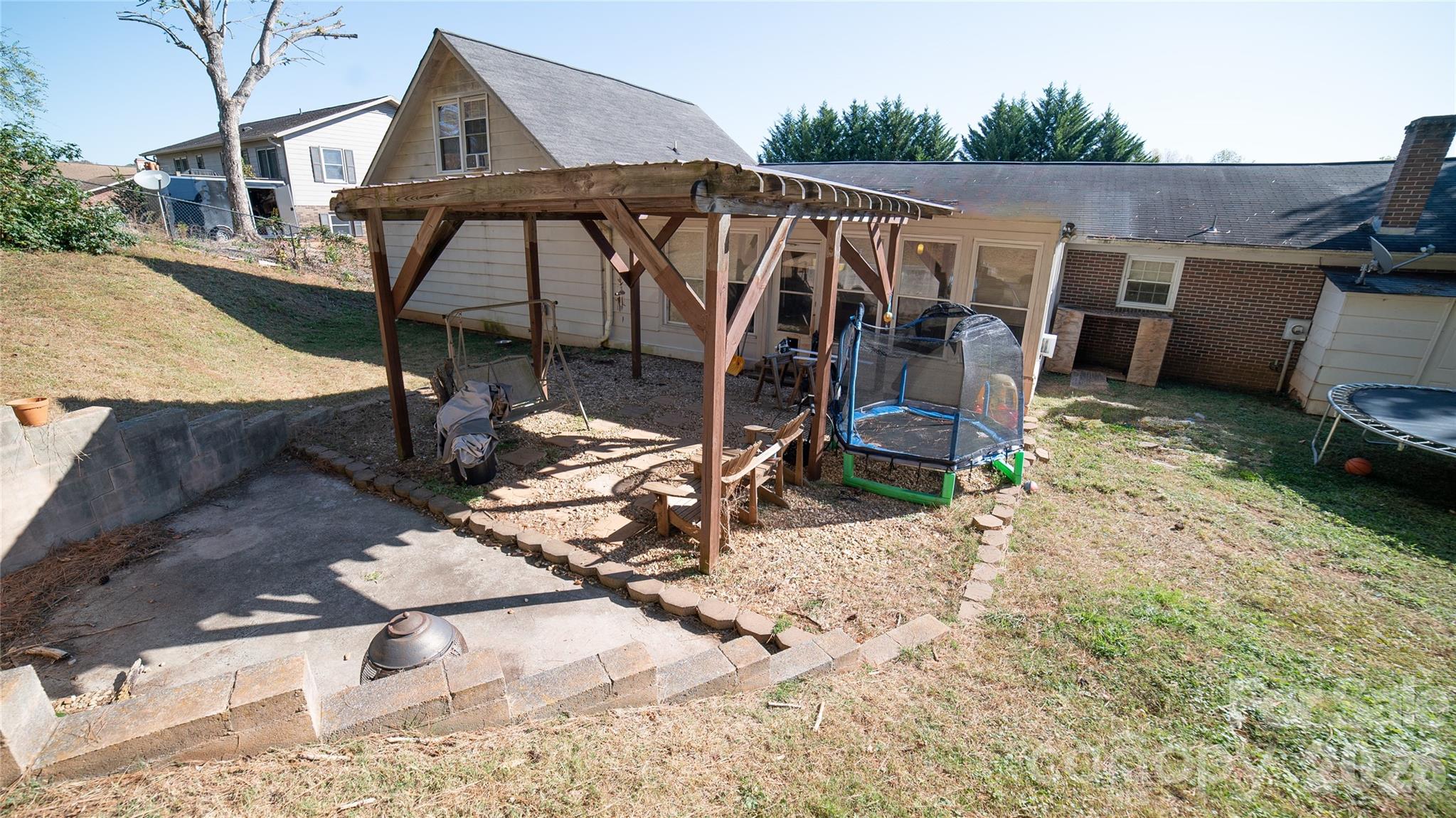 324 Golf Course Road Morganton, NC 28655 - Photo 21 of 21 a view of a wooden deck and a backyard