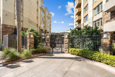 a view of a brick wall with a large trees