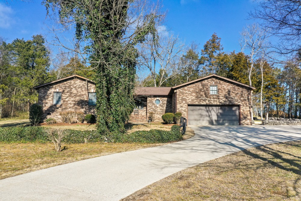 2551 Academy Road Lebanon, TN 37087 - Photo 1 of 45 a front view of a house with garden