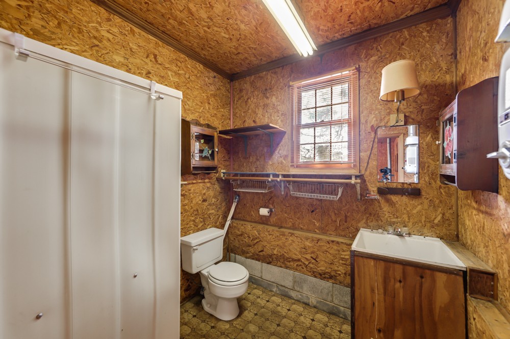 2551 Academy Road Lebanon, TN 37087 - Photo 27 of 45 a bathroom with a granite countertop sink toilet and shower