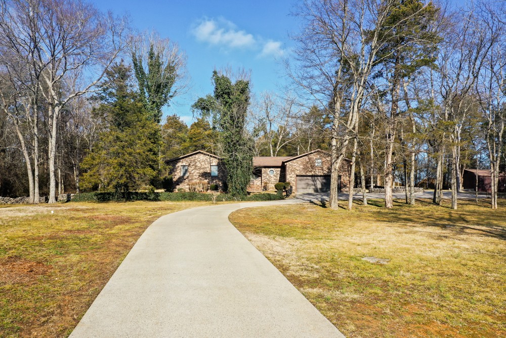 2551 Academy Road Lebanon, TN 37087 - Photo 4 of 45 a swimming pool with trees
