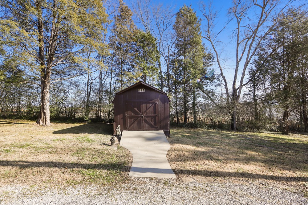 2551 Academy Road Lebanon, TN 37087 - Photo 36 of 45 a street view with large trees
