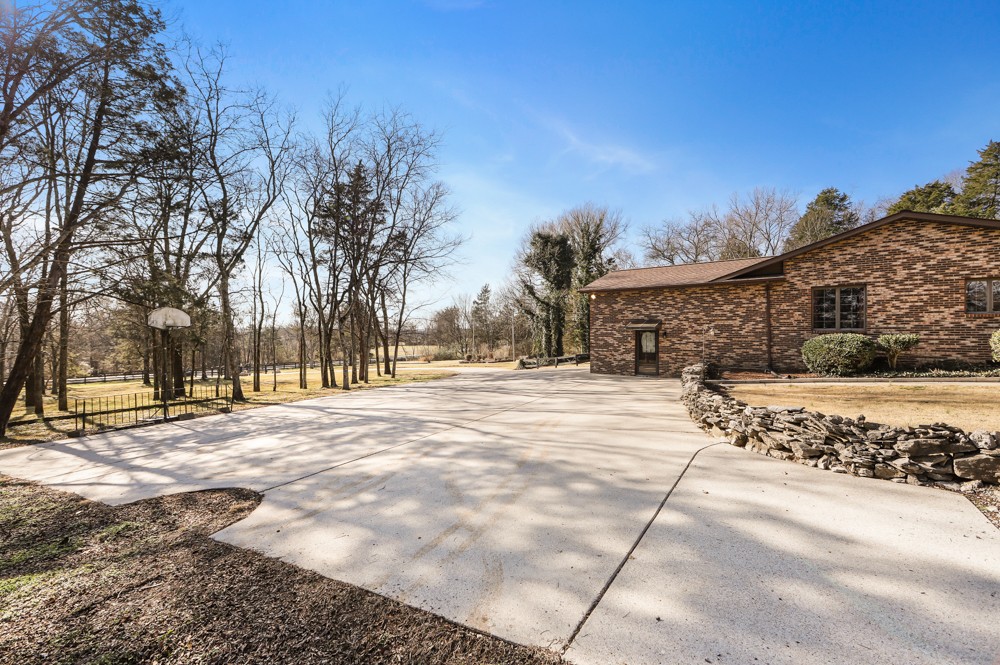 2551 Academy Road Lebanon, TN 37087 - Photo 38 of 45 a street view with large trees