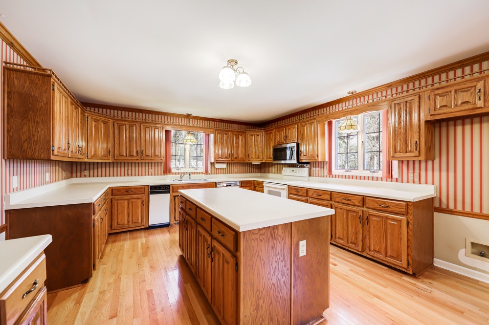 2551 Academy Road Lebanon, TN 37087 - Photo 5 of 45 a kitchen with a stove a sink dishwasher and a refrigerator with wooden floor