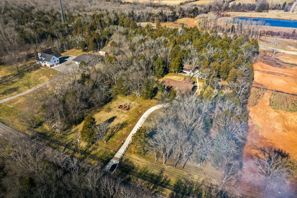 2551 Academy Road Lebanon, TN 37087 - Photo 41 of 45 a view of a yard with plants and large trees