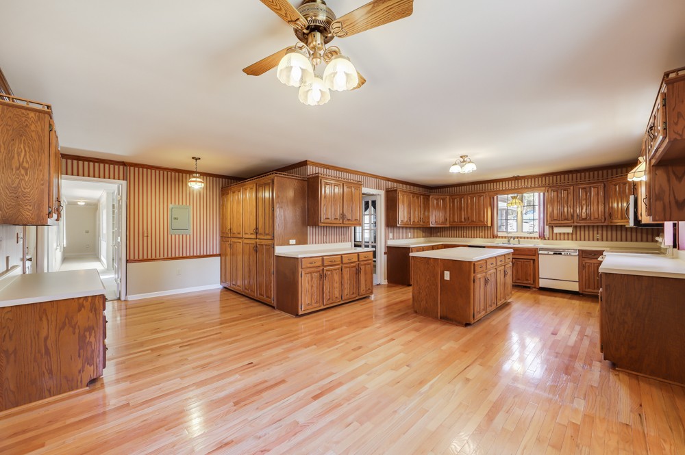 2551 Academy Road Lebanon, TN 37087 - Photo 6 of 45 a large kitchen with stainless steel appliances kitchen island a large counter top and a living room view