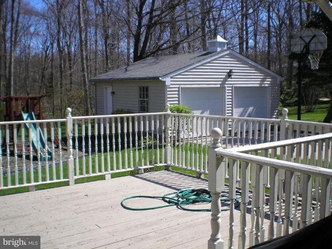 406 Crosby Road Catonsville, MD 21228 - Photo 5 of 23 a view of a wooden deck with a fence
