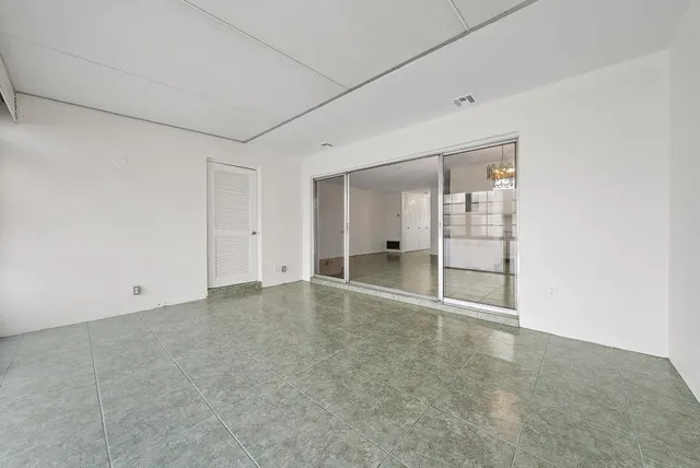 an empty room with glass door