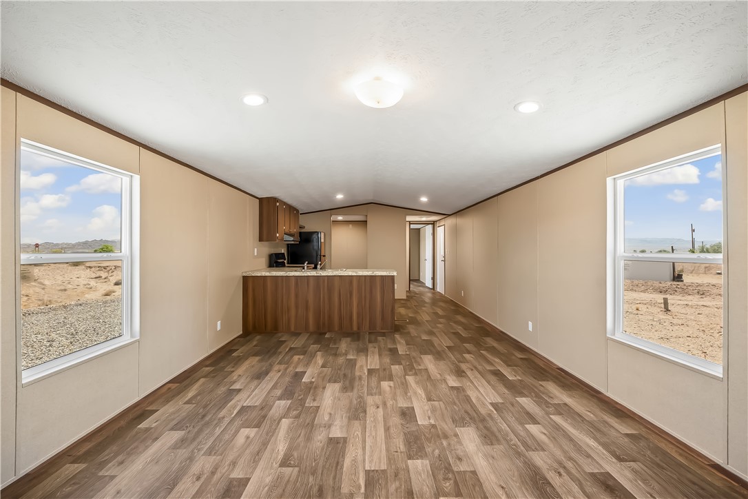 13205 South Water Reed Way Topock, AZ 86436 - Photo 6 of 37 a view of a hallway with wooden floor and a bathroom