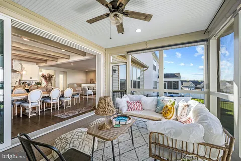 a living room with a bed furniture and a window