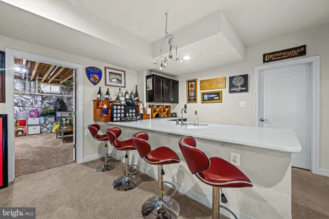 a view of a house with a yard and sitting area