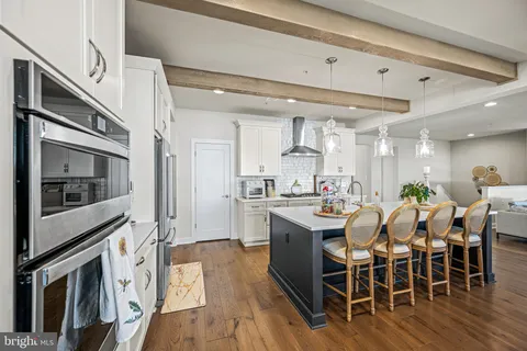 a view of a living room and kitchen