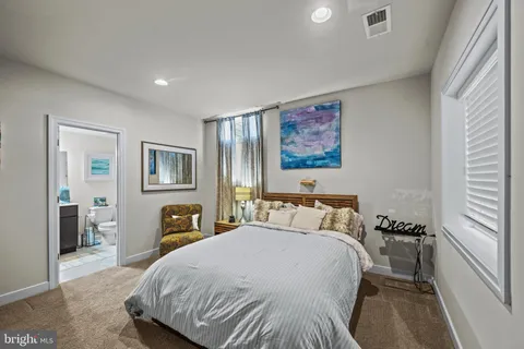 a front view of a house with a yard and a street view