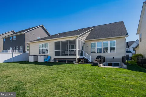 a view of a swimming pool with a lounge chair