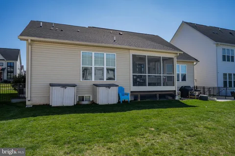 a view of a balcony with a yard