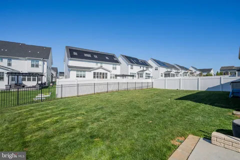a view of an ocean house and a big yard