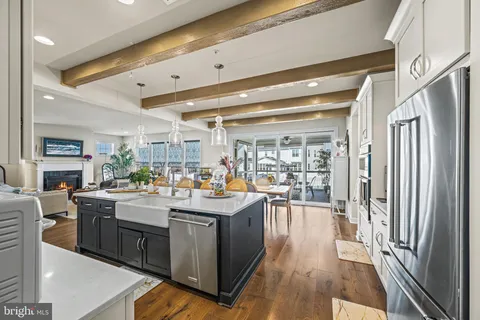 a large kitchen with kitchen island a lot of counter space