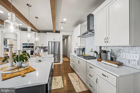 a kitchen with lots of counter top space and a sink