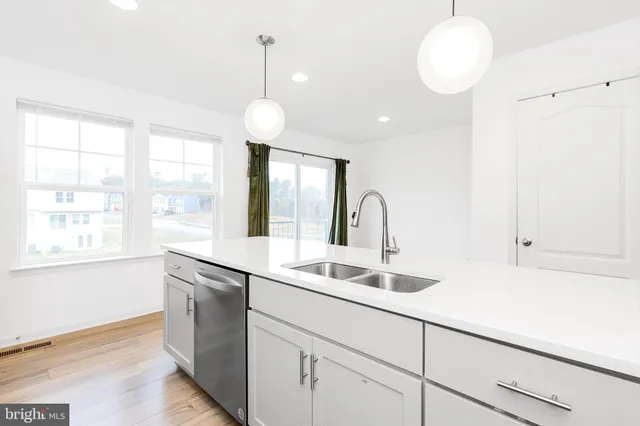 a view of hallway with wooden floor