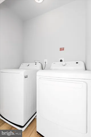 a bedroom with a bed and hallway