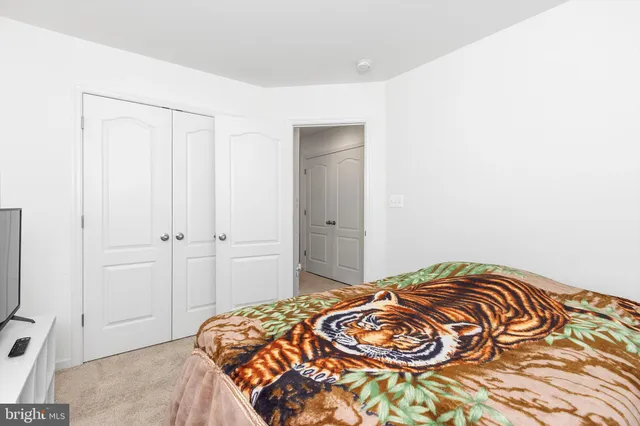 a view of a hallway with wooden shelves