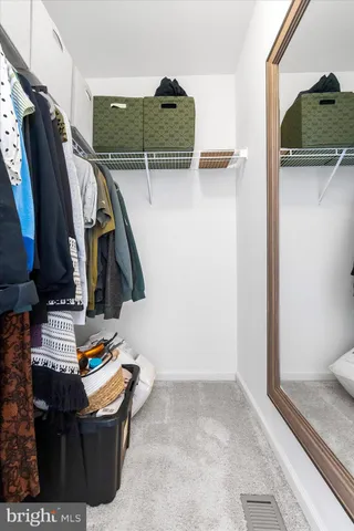 a bathroom with a sink double vanity and a mirror