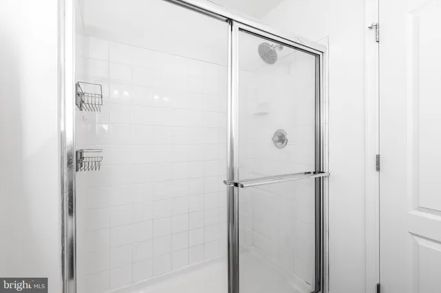 a bathroom with a toilet and a shower curtain