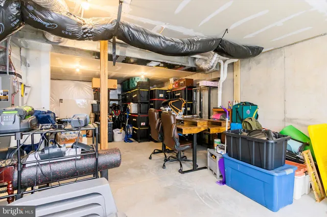 a view of living room with furniture and gym equipment